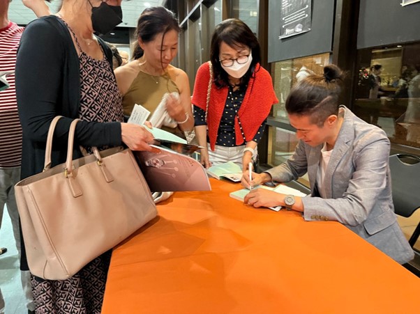 Photo: Director Juhn holding a signature event for his book