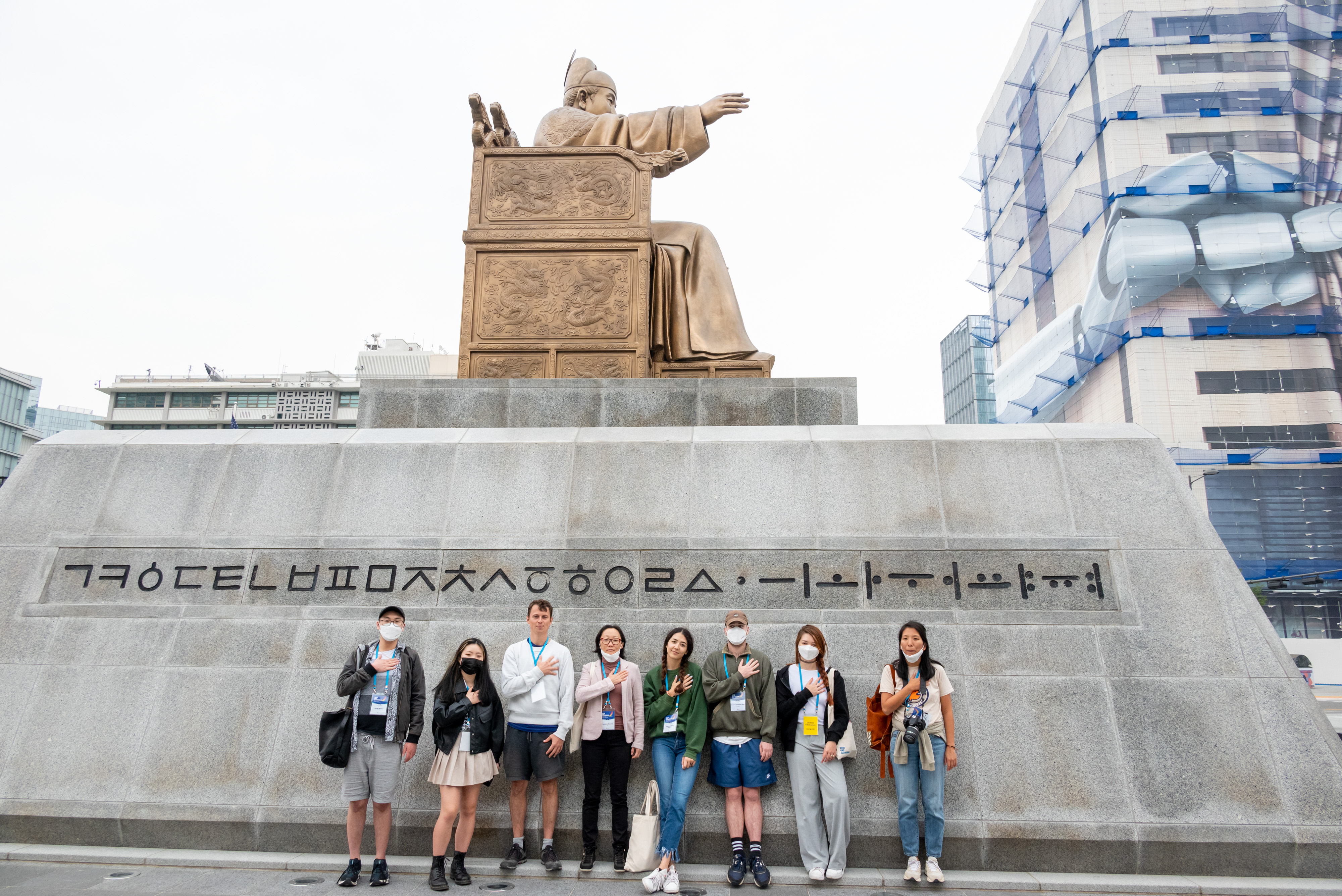 [K-Tour (Heritage)] Adoptee participants taking poses in front of the statue of King Sejong