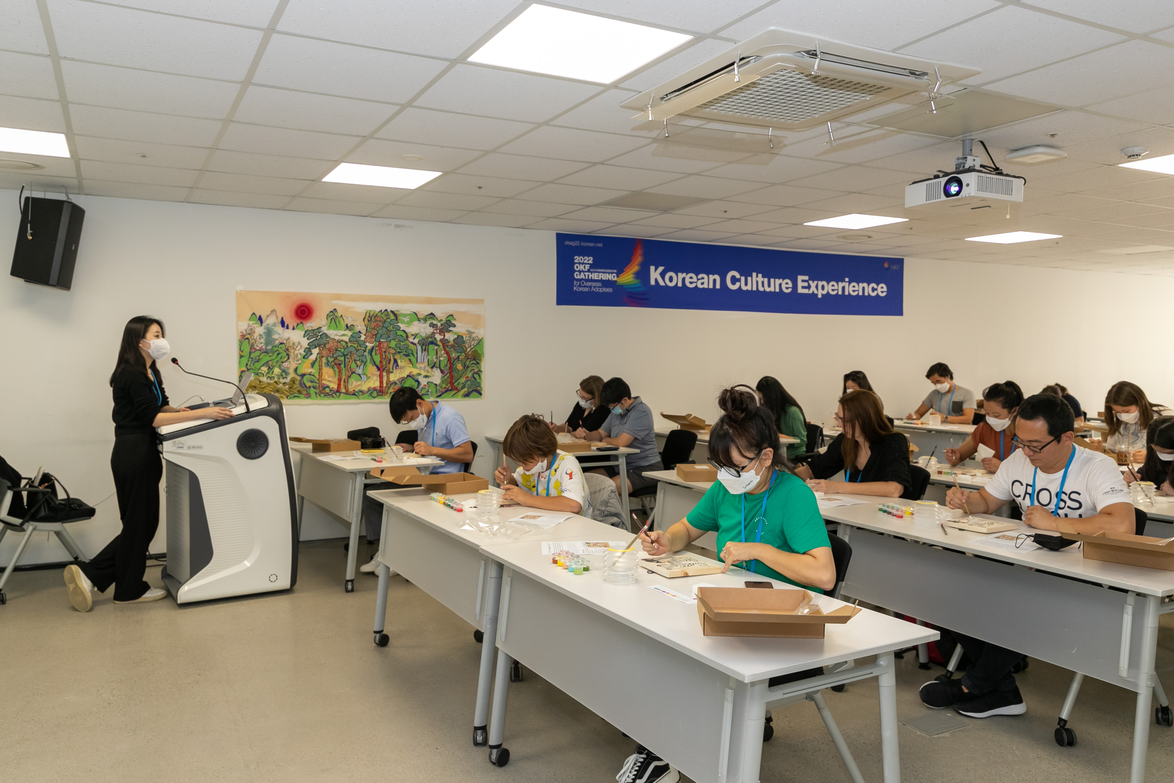 [K-Art] Adoptee participants using the traditional Korean colors of the five directions (yellow, red, blue, black, white) to draw their very own beautiful folk paintings