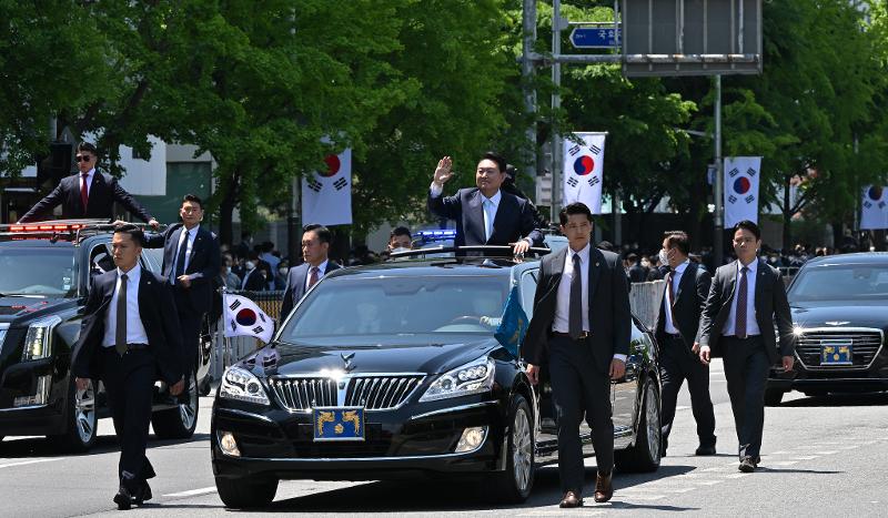 President Yoon Suk Yeol on May 10 waves to the crowd in a motorcade after his inauguration ceremony at the National Assembly in Seoul. (Kang Min-seok from Presidential Security Service)