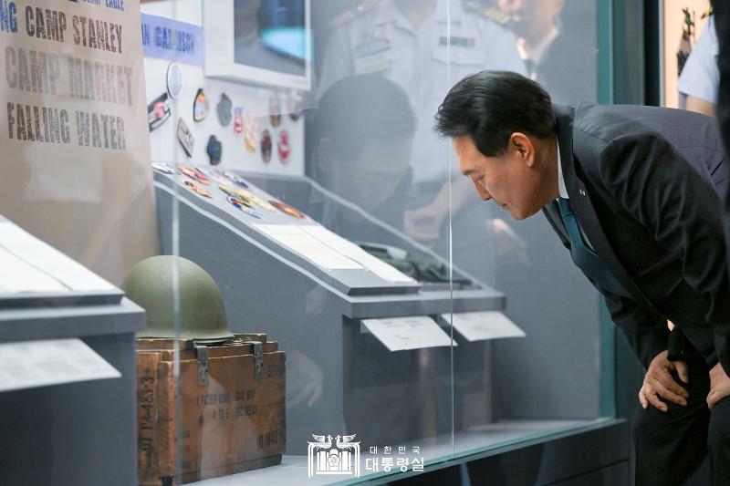 President Yoon Suk Yeol on June 25 looks around an exhibition at the National Museum of Korean Contemporary History in Seoul commemorating the 70th anniversary of the nation's bilateral alliance with the U.S.